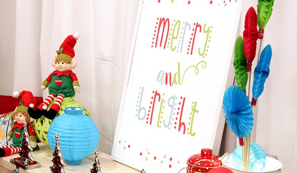 Merry & Bright Poster Blog Image - Placed in a table with Girl and Boy sitting elf
