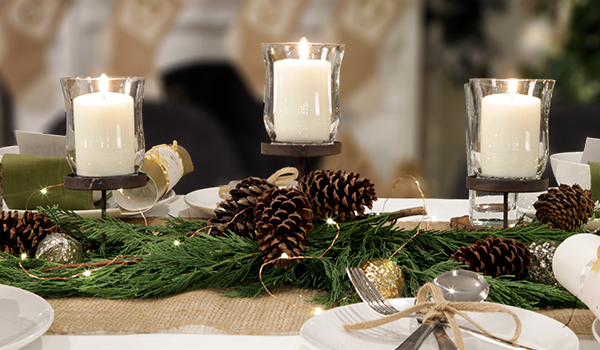 make and create woodlands table center with pinecones and string lights, candles