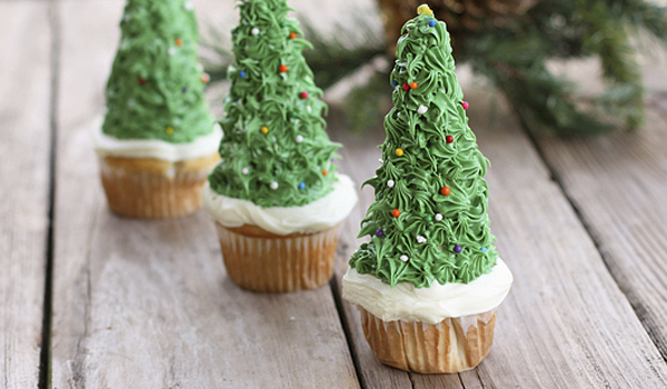 Christmas Tree Cupcakes placed in a wooden surface