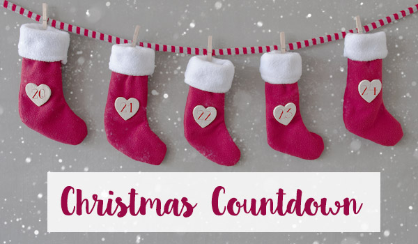 Christmas Countdown - Christmas red stockings hanging in a clip