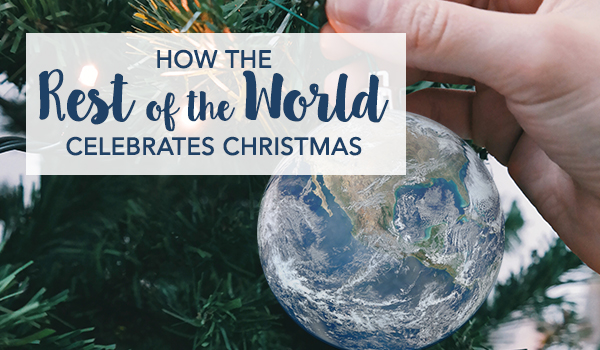 How The Rest of the World Celebrate Christmas - Hanging an earth design bauble on a christmas tree