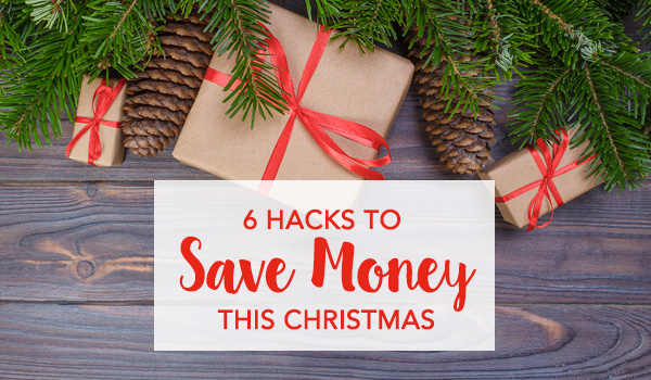 Christmas gifts and pinecone under a christmas tree - 6 Hacks to Save Money this Christmas