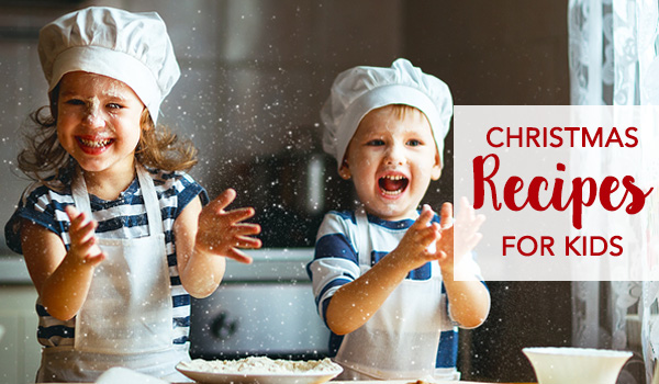 Two kids trying to bake for christmas and enjoying themselves - Christmas Recipes for Kids