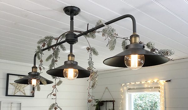 Hang Garlands from Light Fittings - Top 10 ways to decorate with Christmas Garlands