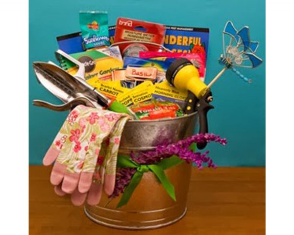 Bucket with gardening supplies inside and Gardening gloves