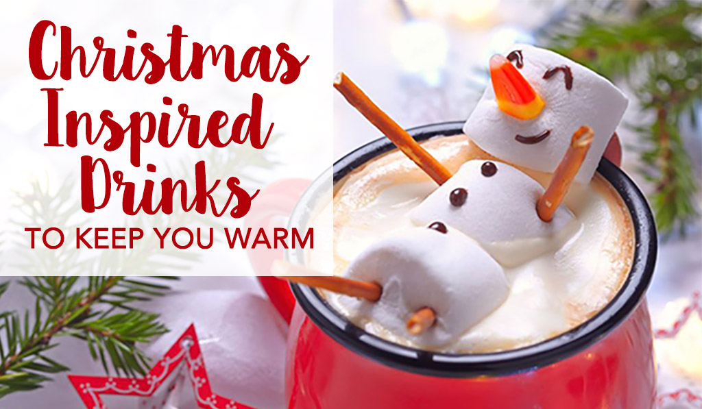Christmas in July Drinks to keep you warm with a snowman marshmallow smiling - Christmas Inspired Drinks to Keep You Warm