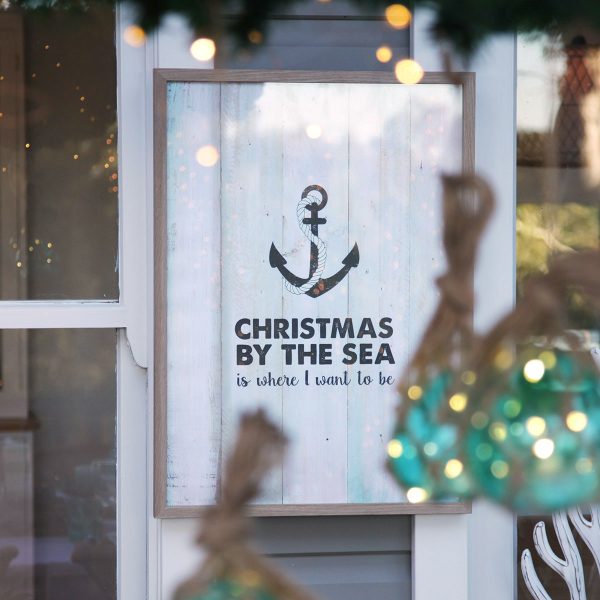 CHristmas By the Sea Poster Hanging in a Wall