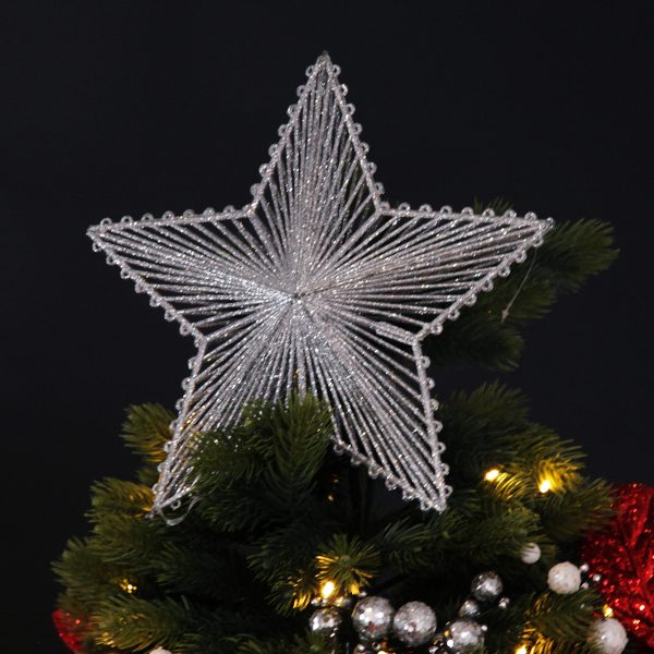 3D silver star placed on top of a christmas tree with black background