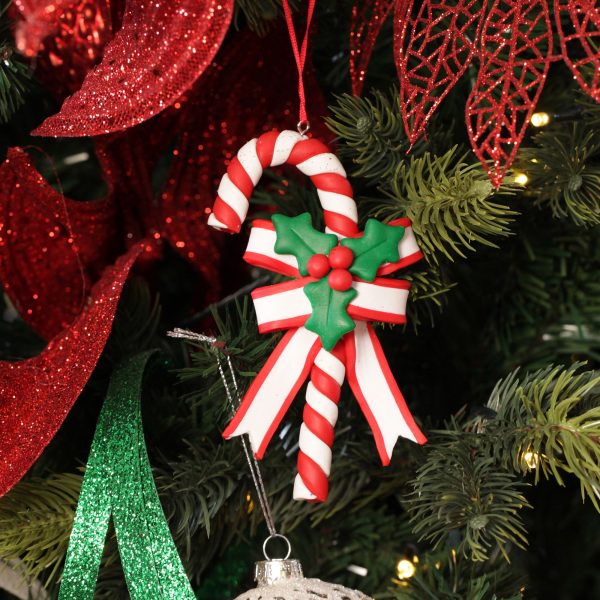 A Christmas Kitchen Candy Cane Decoration Hanging in a Christmas Tree