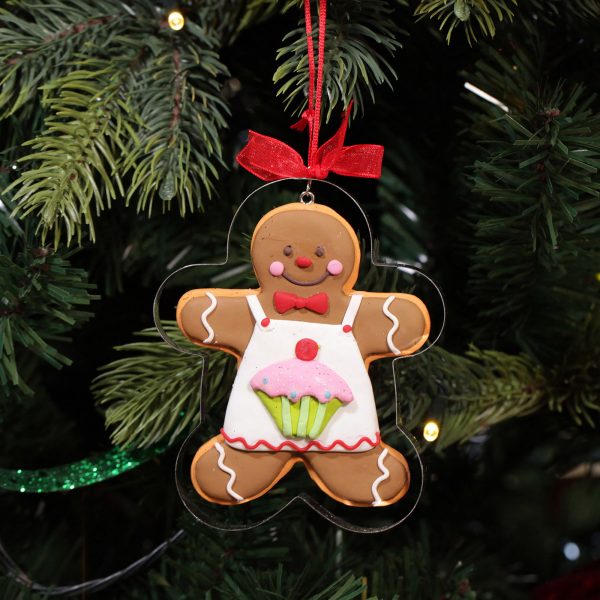 A Christmas Kitchen Gingerbread man Cookie Cutter Decoration Hanging in a Christmas Tree