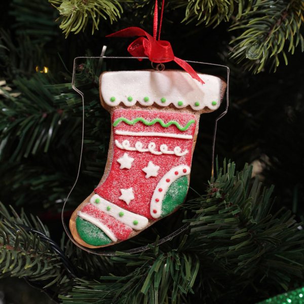 A Christmas Kitchen Gingerbread Stocking Cookie Cutter Decoration Hanging in a Christmas Tree