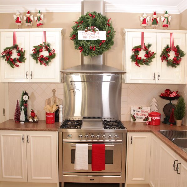 A Christmas Kitchen Oven Range with wreaths and other ornaments