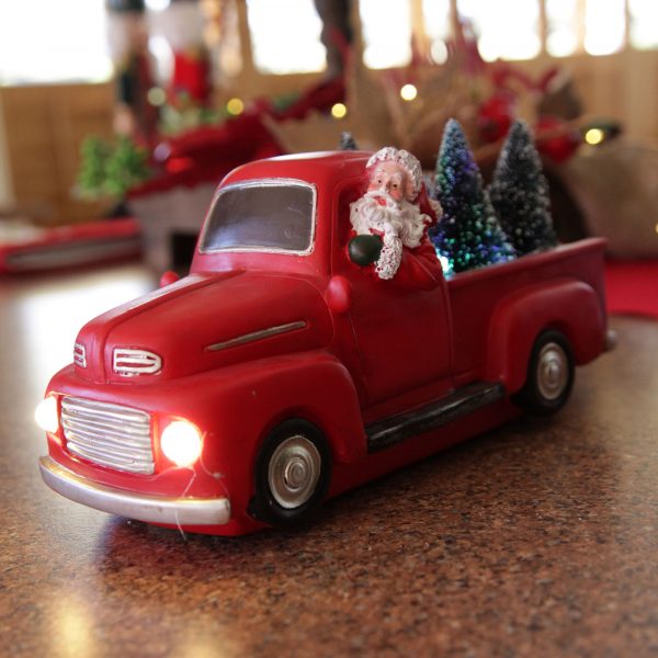 A Christmas Kitchen Red Ute Lightup Ornament Placed in a Counter