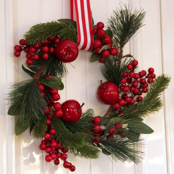 A Christmas Kitchen Small Apple and Berry Wreath Hangin in the Wooden Wall