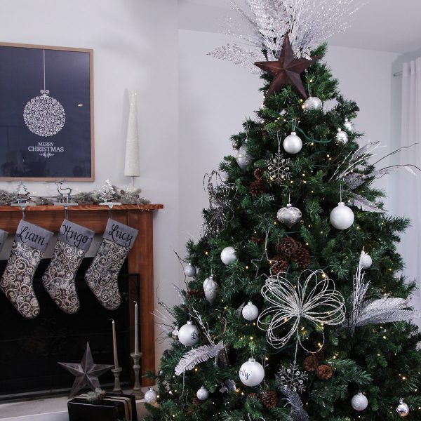Elegant CHristmas - Large Christmas Tree placed in the living room with a fireplace