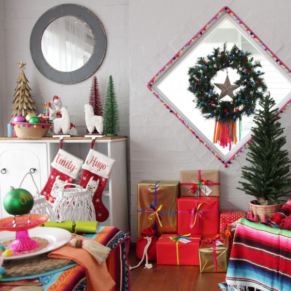 Falalala Llama Christmas Fiesta room shot with christmas gifts below