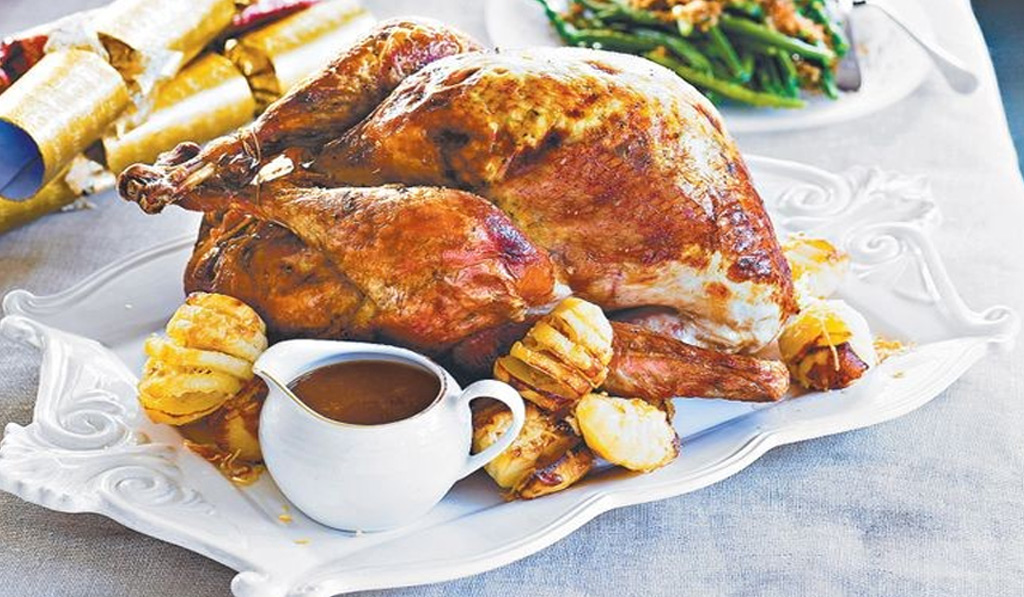 Traditional Turkey with a Twist with gravy and potatoes