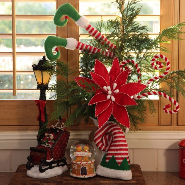 Christmas Kitchen Middle Windows Vignette with Floral and Elf legs, Ginger bread snow globe, sleigh ornament with elf hat