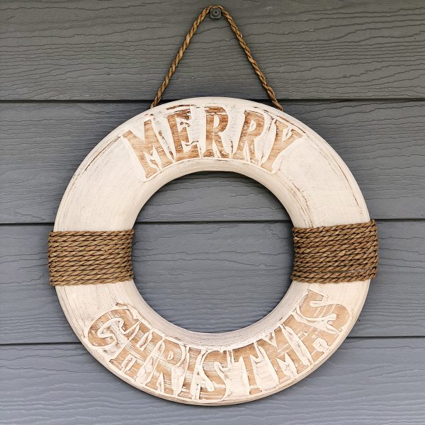 Christmas Wooden Wreath Hangs on the Wooden Panel Merry Christmas brown Writing
