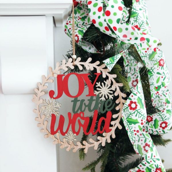 Candy Cane Christmas Joy to the World Wooden Circle Wreath Plaque hanging on a garland with polka dots ribbons