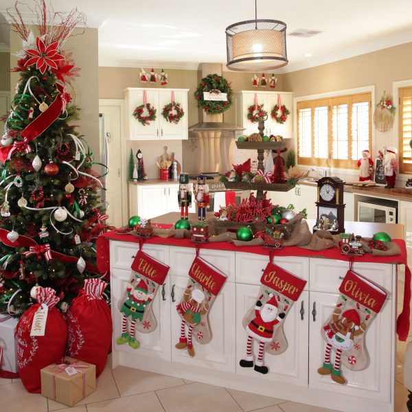A Christmas Kitchen Room with a Big Christmas Tree and Personalised Christmas Stockings