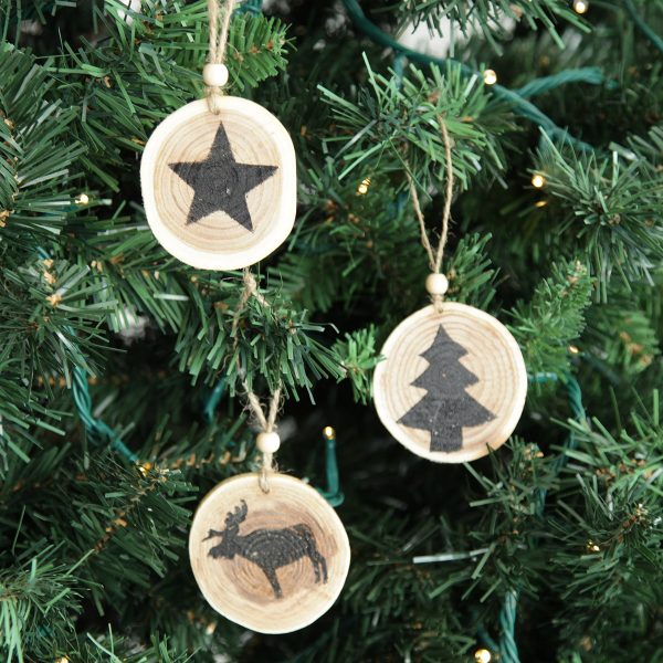 Farmhouse tree decorations hanging in a Christmas Tree
