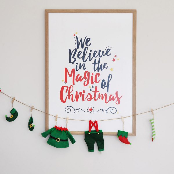 We believe in the Magical Christmas Morning Poster Hanging in a Wall