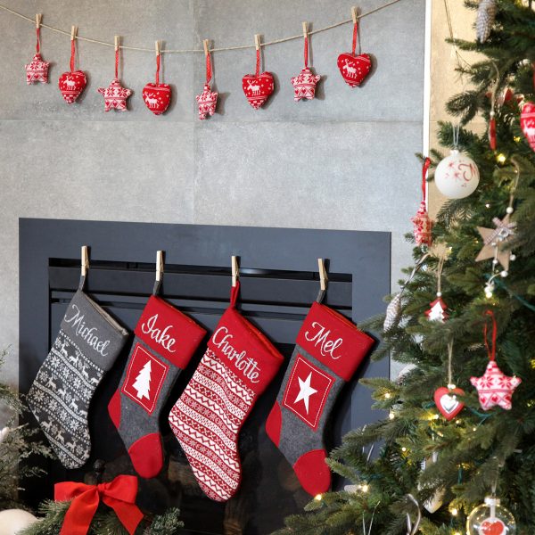 Nordic Christmas Personalised Stockings Hanging in a Fire Place
