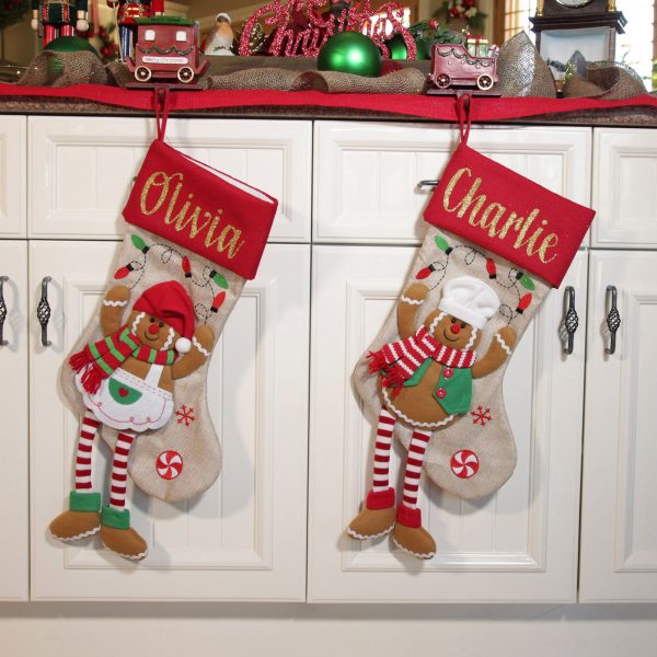 A Christmas Kitchen Gingerbread Boy & Girl Stocking with Dangly Legs hanging