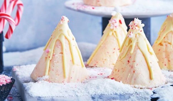 Candy Cane Cheesecake Ice Cream Cones with White Cream Topping