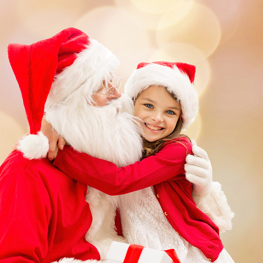 Girl Hugging Santa wearing a red Cardigan and also a Santa Hat