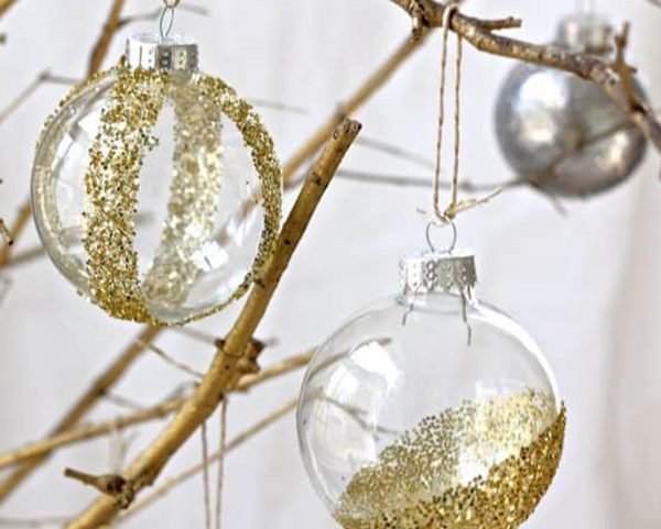 Glitter Dipped Baubles with Gold and Glittery Colour Hanging in a Tree Branch