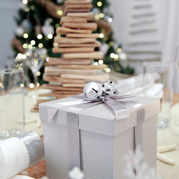Metallic Silver Gift Box with Bells on Table