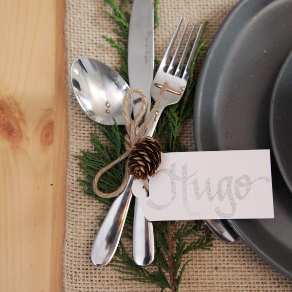 Hygge Table setting with spon knife and fork gift tag named Hugo