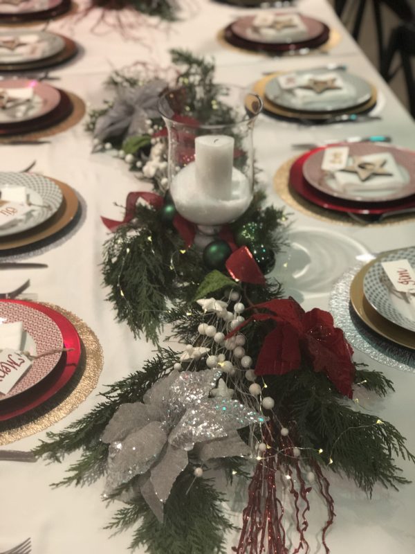Table setting with plates and Candle in the middle Garland