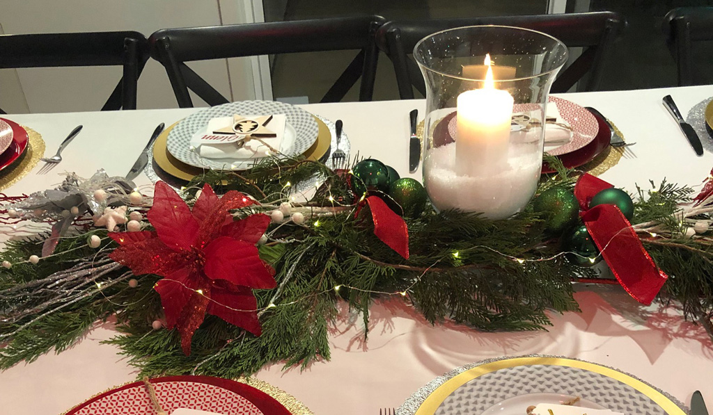 Big Candle Placed in the Table with Wreath and Garland