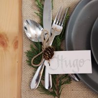 hygge table setting with Fork Spoon and Bread Knife and a Gift tag