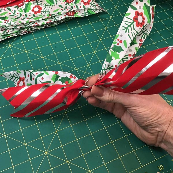 Holding a Pinch Christmas Ribbon Streamers