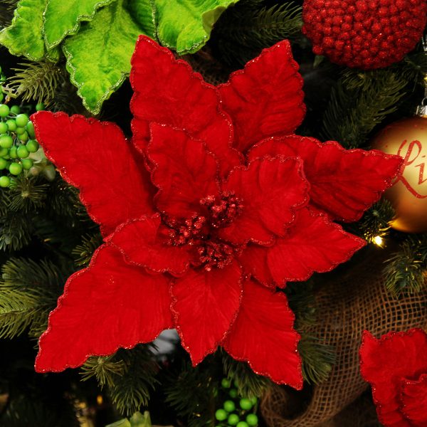 Red Poinsettia Flower Pick with Red Trim Attached in a Christmas tree