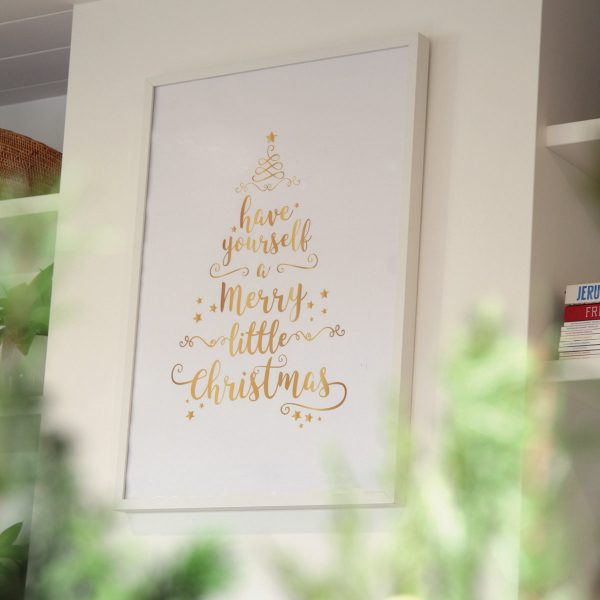 Have yourself a Merry Little Christmas Poster Hanging in a Wall