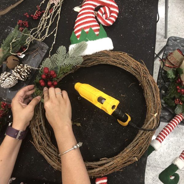 How to make a DIY wreath with a glue gun and Red Berry attached to it