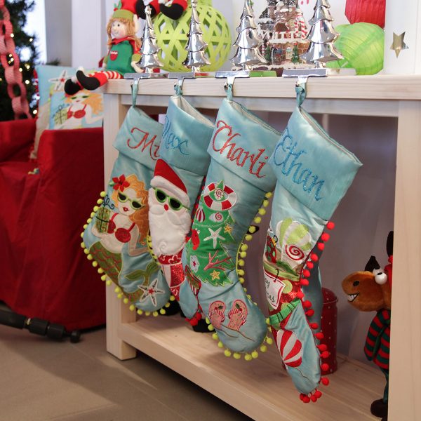 Personalised Christmas Stocking Hanging in a Wooden table