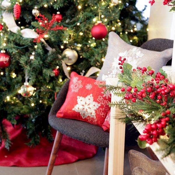 Designer Cushion Cover Set Placed in a Chair infront of a Christmas Tree