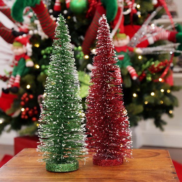 Green and red wire christmas trees with snow