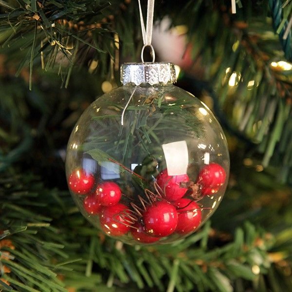 Craft Bauble with Red Berry Inside Hanging in a Christmas Tree