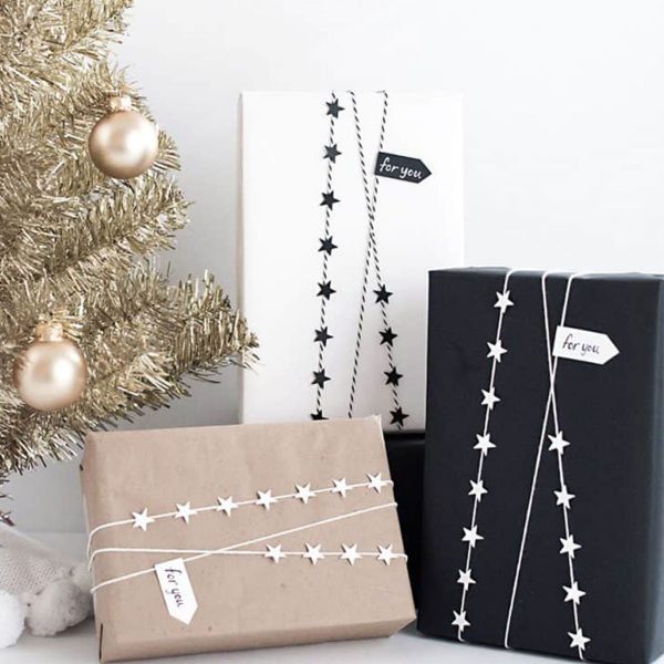 Beatiful Christmas Gift Wrapping Ideas Tan, White, Black Wrapper beside the golden Small Christmas Tree