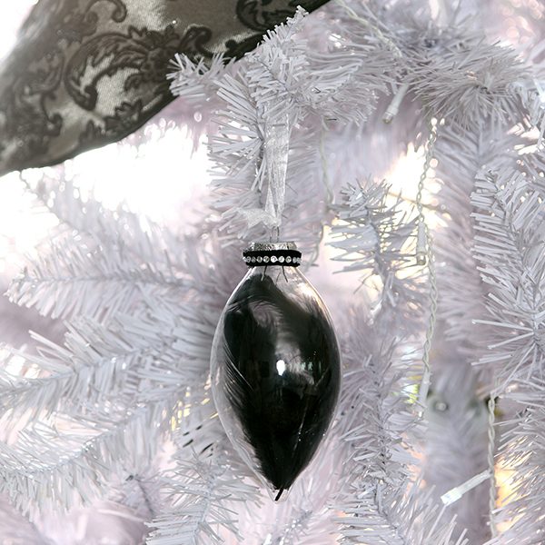 Black Feather Craft Bauble Hanging in a White Christmas Tree