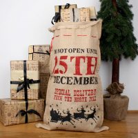 25th December Burlap Santa Sack with Wrapped gifts Beside