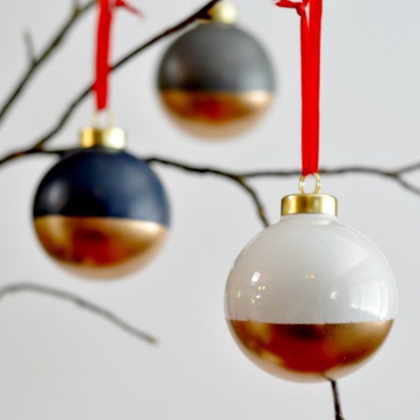 Gold Dipped Ornaments Hanging in a Tree Branch
