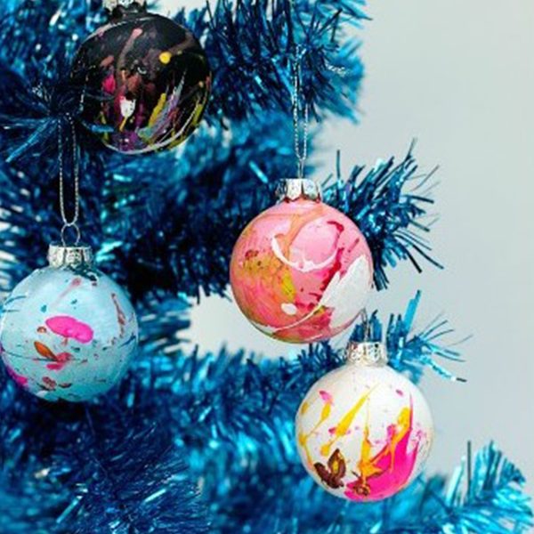 4 Painted Baubles Hanging in a Blue Christmas Tree